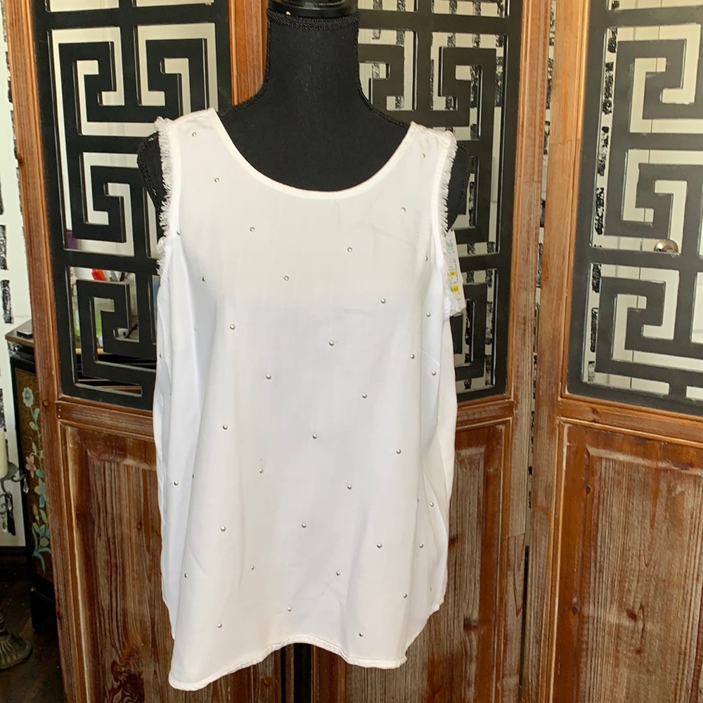 White sleeveless top with stud details